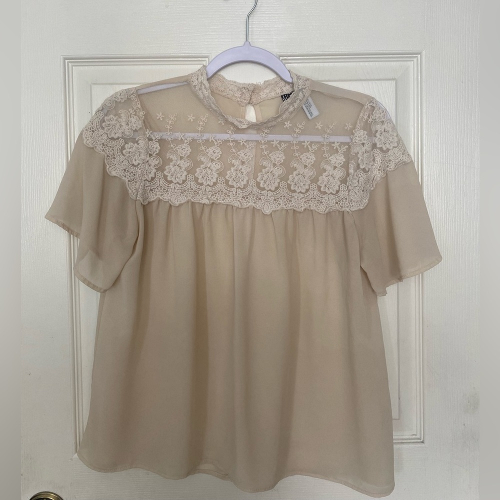 Size small see-through shirt. Cute with a skirt and bandeau